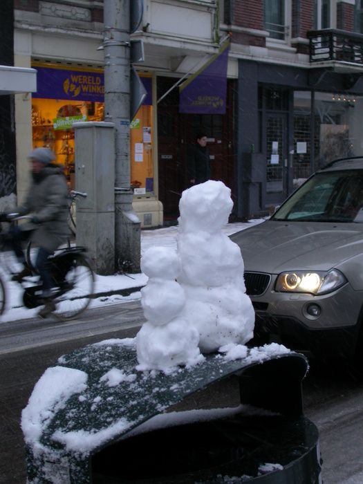 snow family waits for the tram