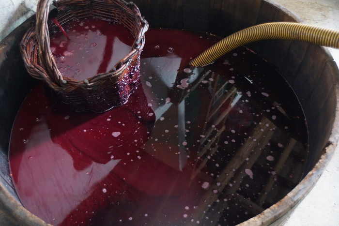 wine draining through wicker basket